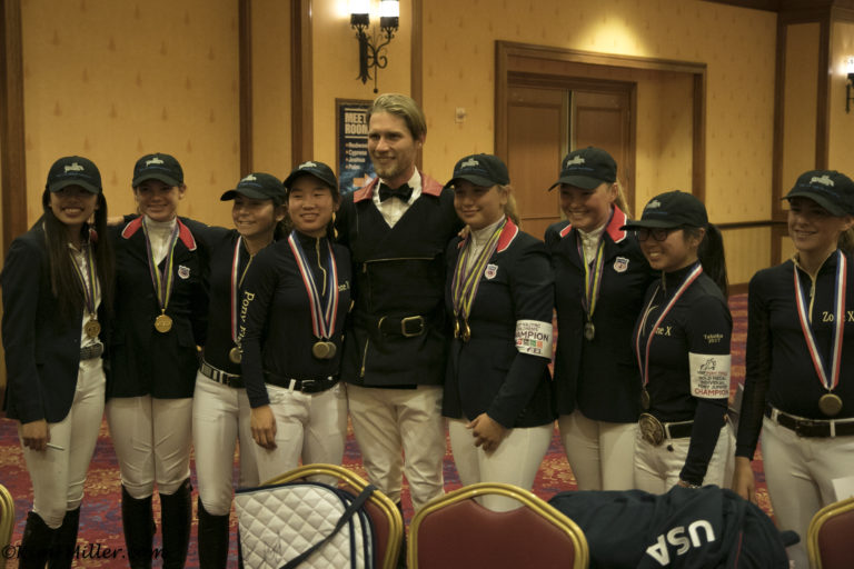 Sixth place finisher Karl Cook celebrates with members of the Zone 10 Pony and Childrens Jumper teams, who were honored before the competition